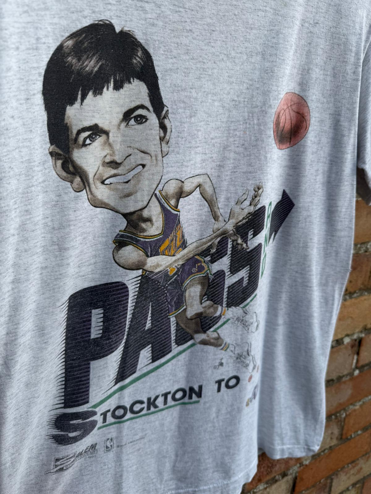 T-shirt with a big head graphic of Utah Jazz basketball player and text on a white background