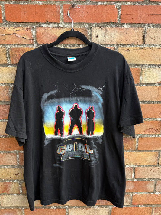 Black t-shirt with 2 Cool graphic design on a brick surface