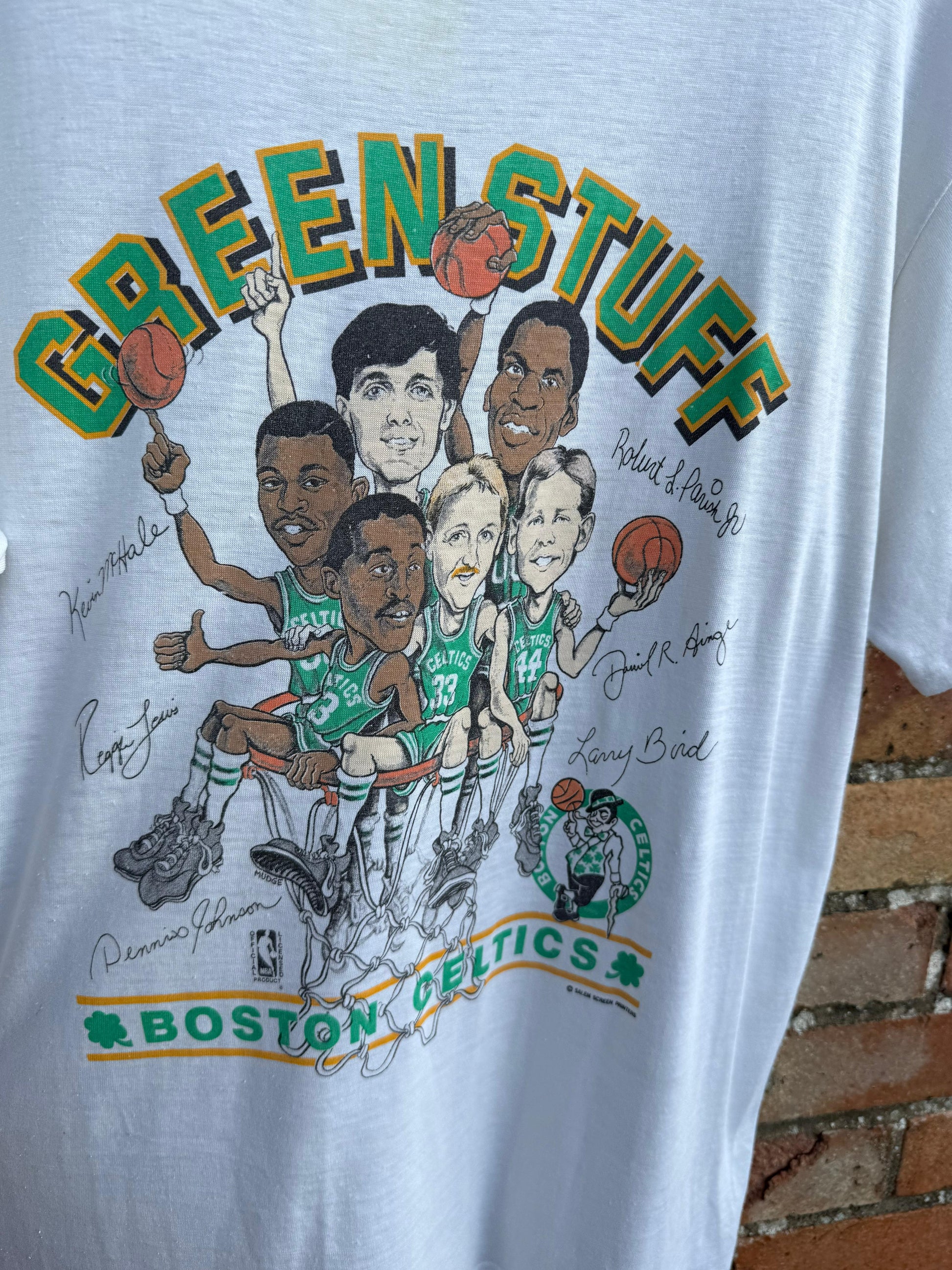 Vintage t-shirt with cartoon caricature of Boston Celtics players and 'Green Stuff' text.