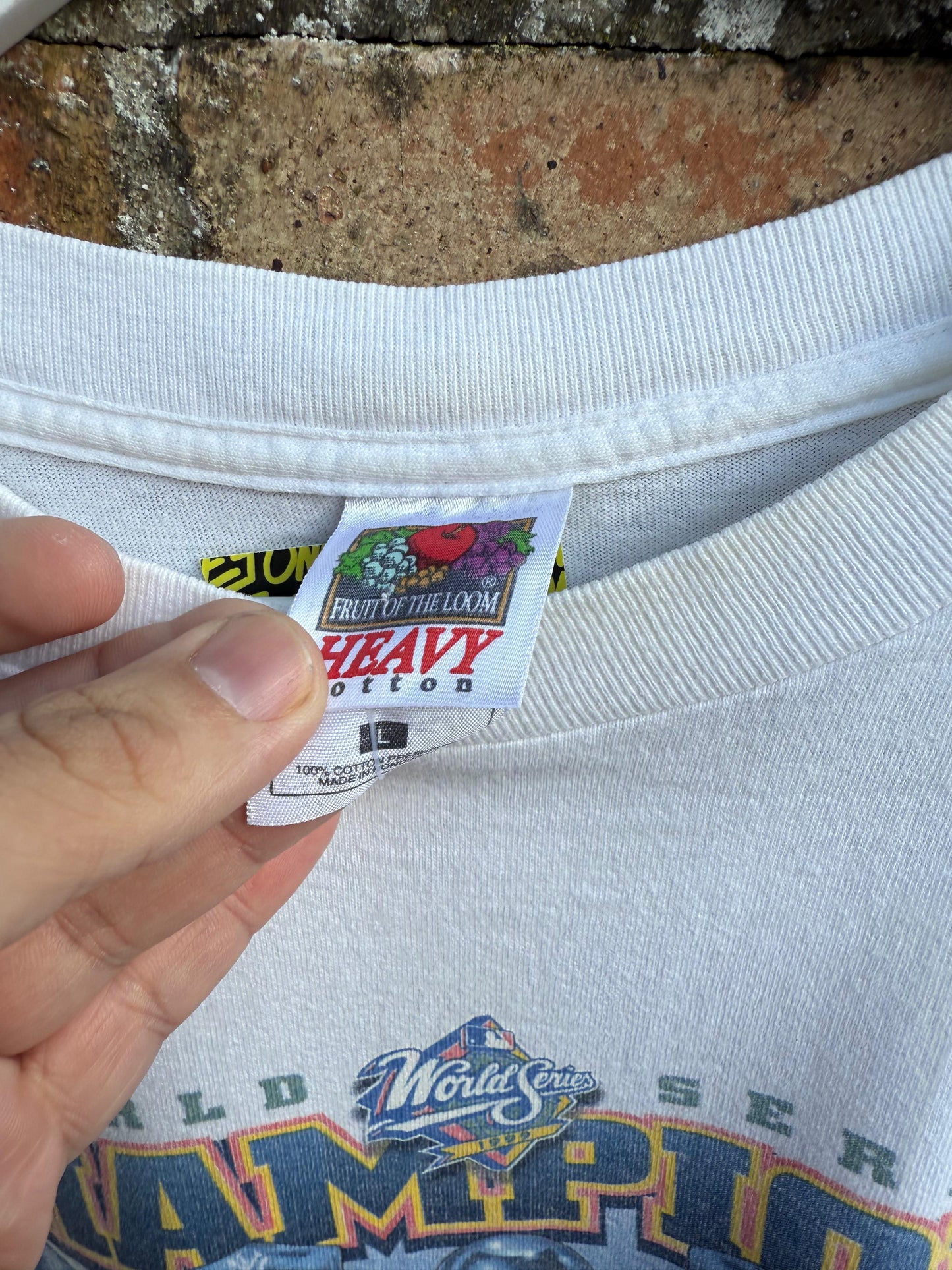 Close-up of a Fruit of the Loom 'Heavy Cotton' label on a sports t-shirt