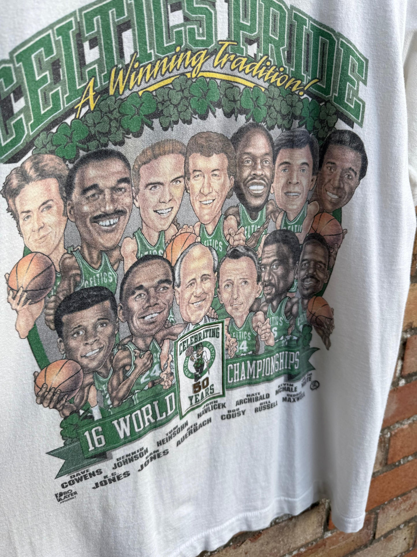 T-shirt with a graphic of Boston Celtics Championship basketball team and text celebrating Celtics Pride