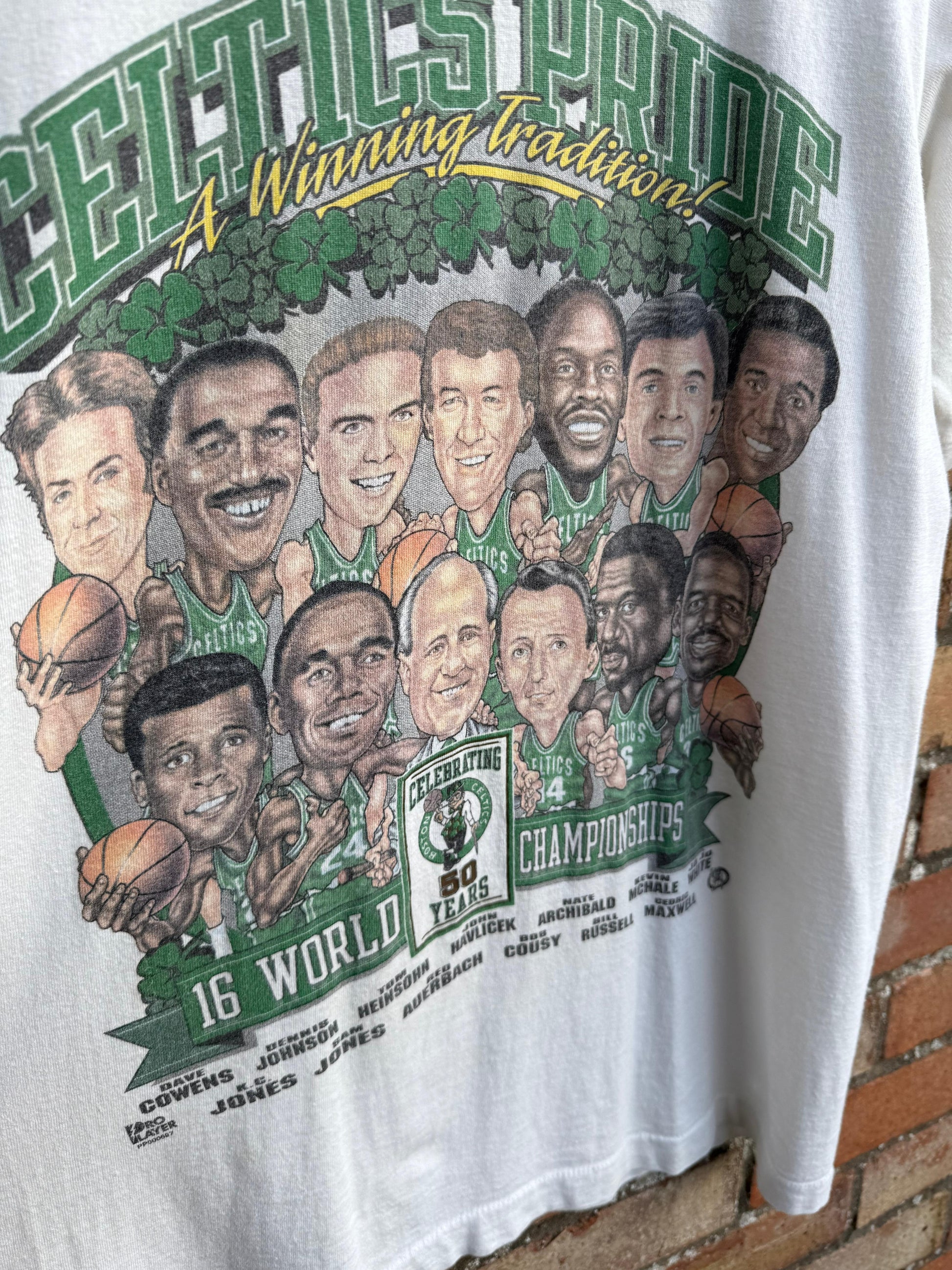 T-shirt with a graphic of Boston Celtics Championship basketball team and text celebrating Celtics Pride