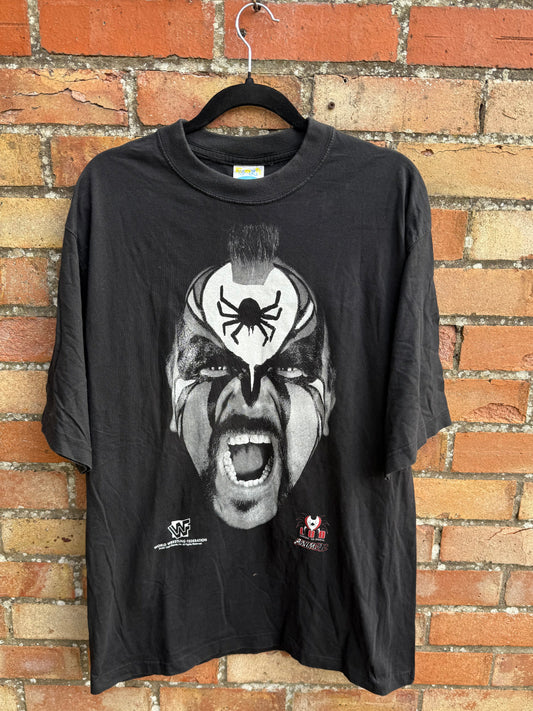 Black t-shirt with graphic design and WWF branding on a brick surface