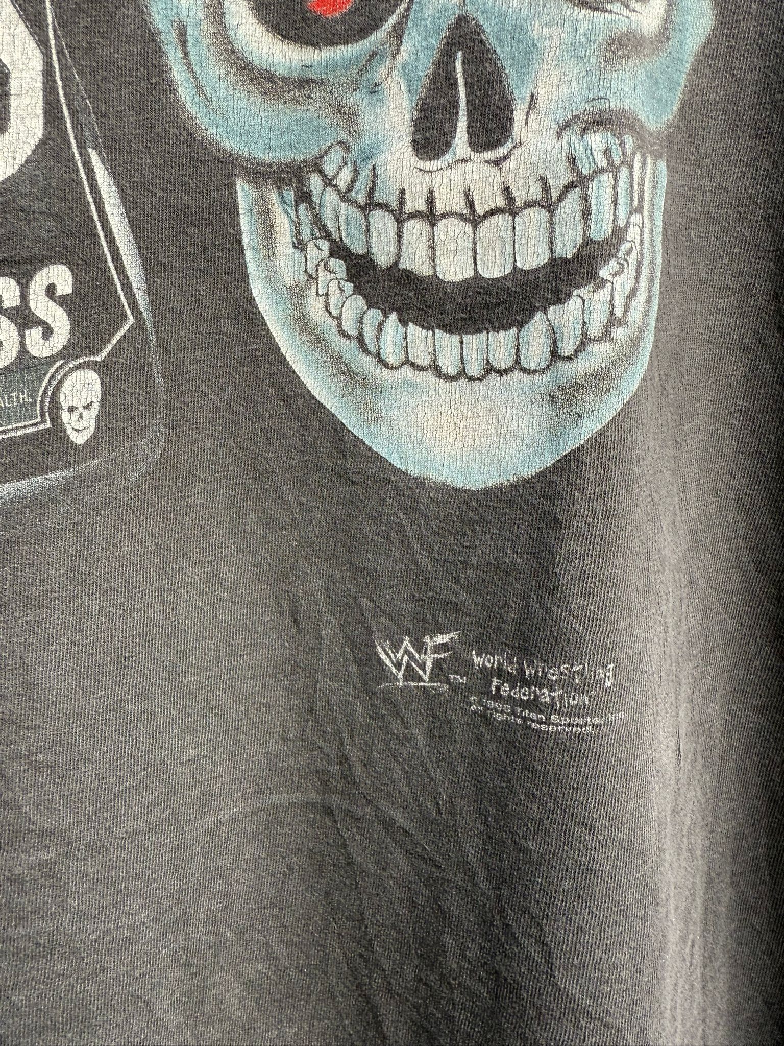Black t-shirt with a skeleton face graphic and World Wrestling Federation logo.