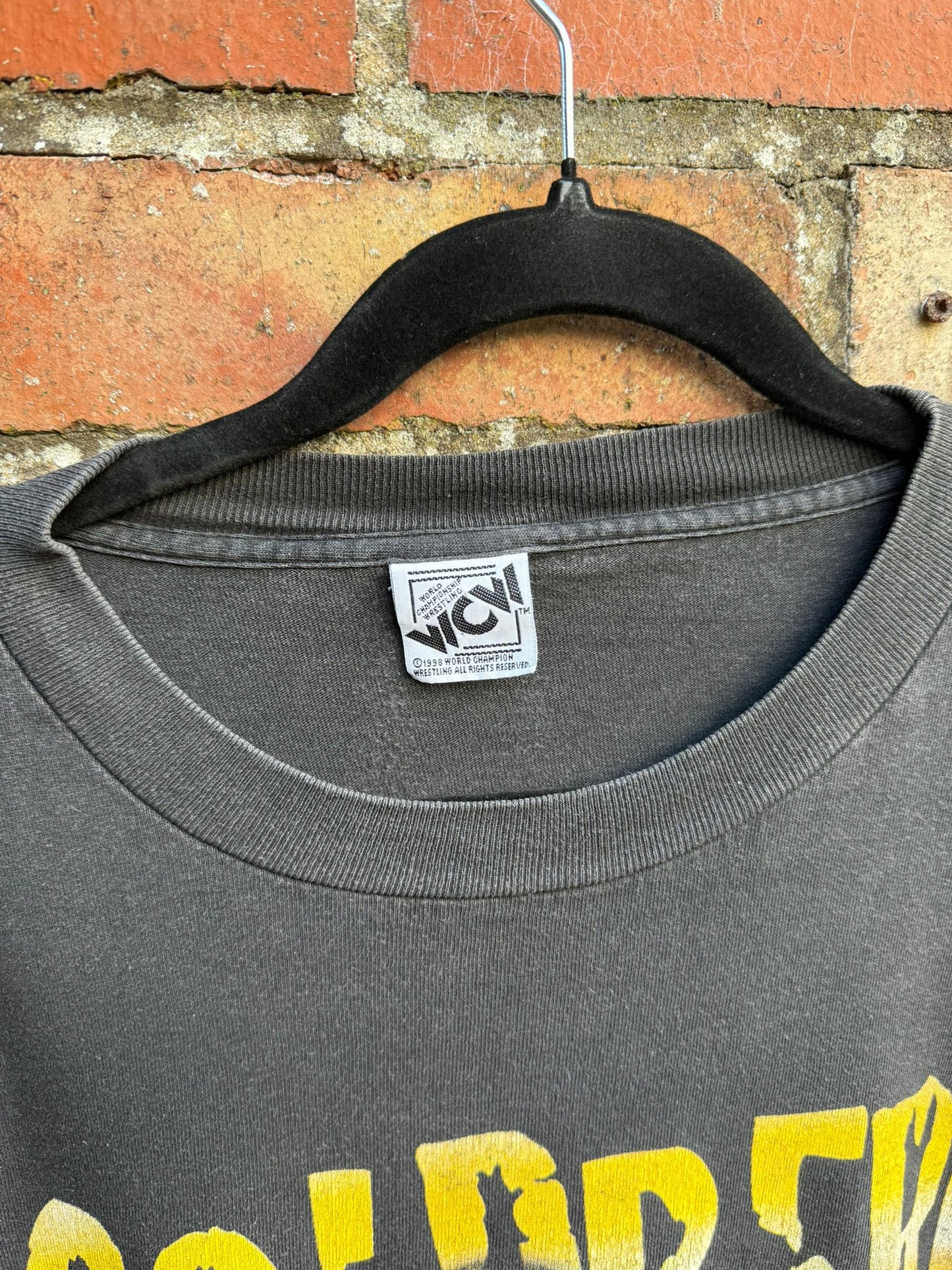 T-shirt tag showing WCW 199 World Championship Wrestling
