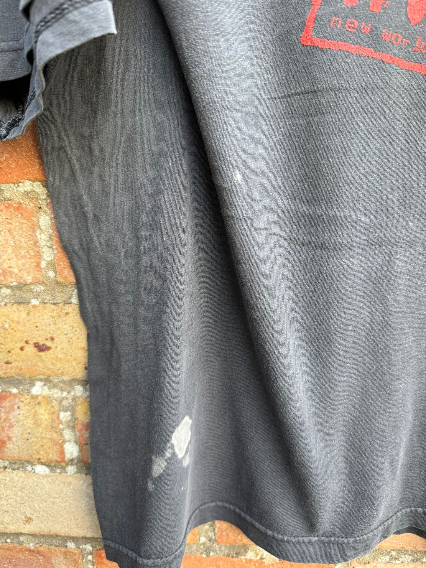 Close up of possible bleach stain on a black t-shirt with nWo logo