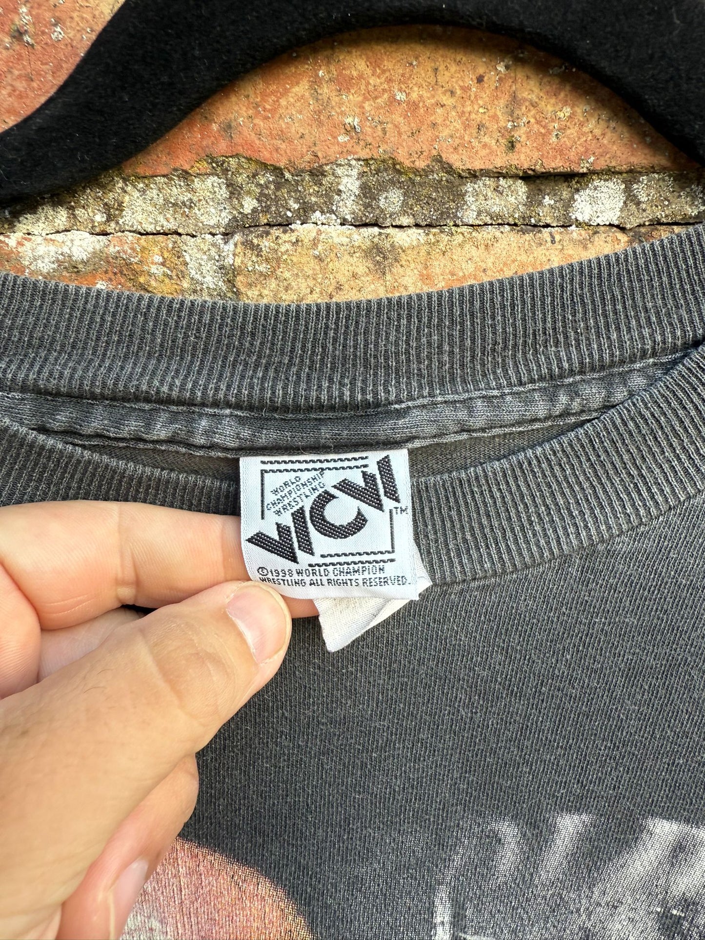 Black t-shirt with WCW tag showing