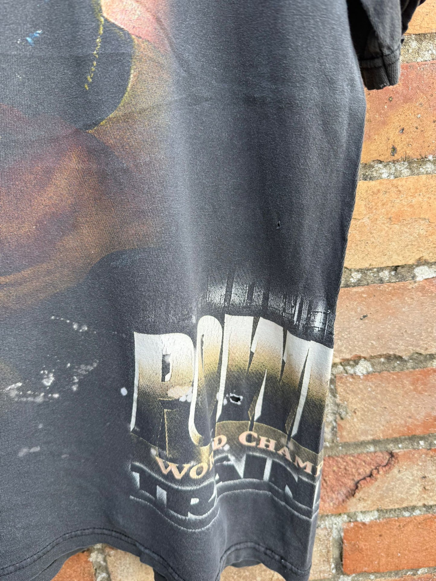 Black t-shirt with visible branding for World Championship Wrestling