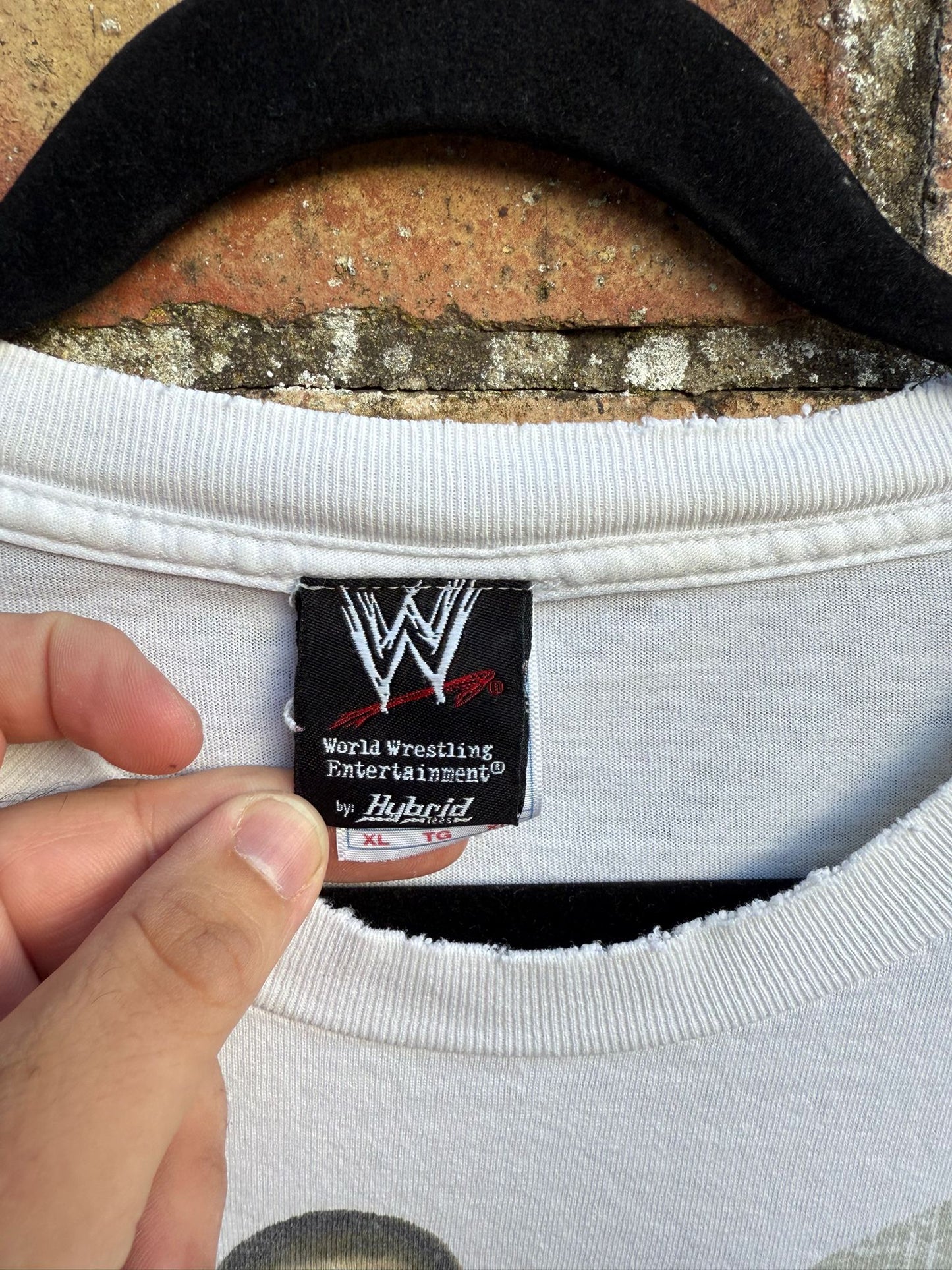 Close up of t-shirt tag with WWE and size XL