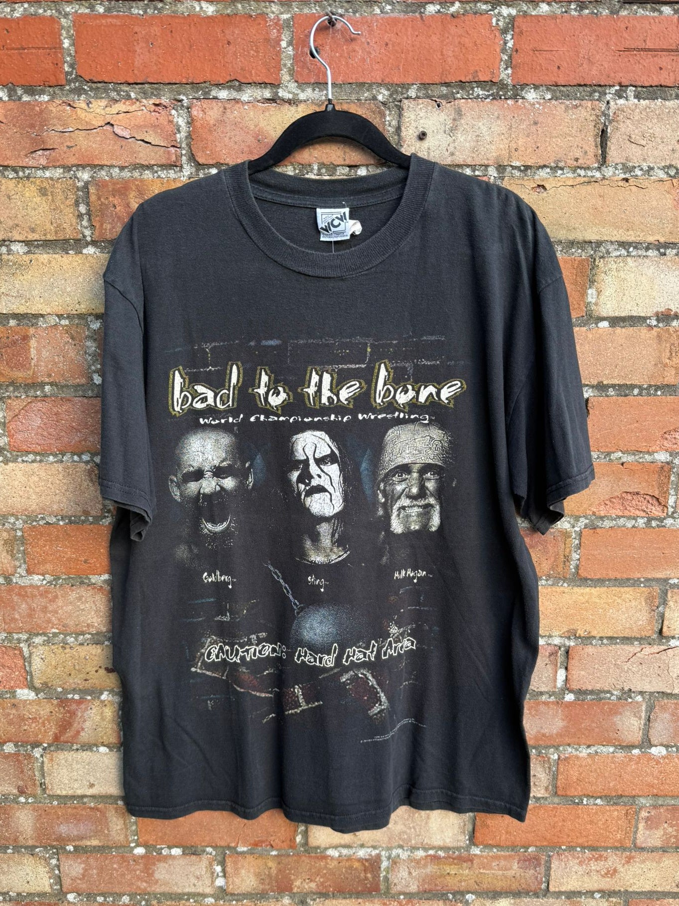 Black vintage wrestling t-shirt featuring Hulk Hogan, Goldberg and Sting from 1998