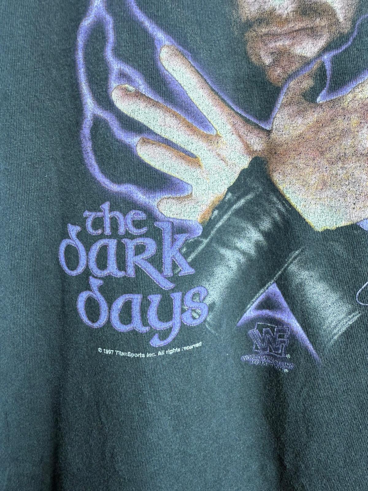 Close-up of Titan Sports Inc 1997 copyright statement and WWF logo with text The Dark Days