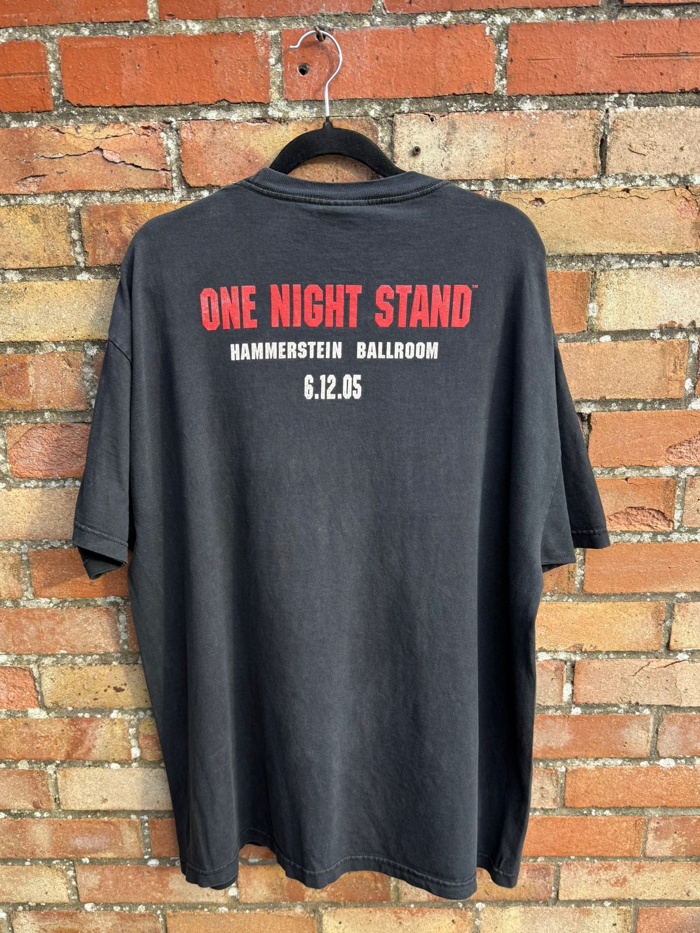 Black t-shirt with red One Night Stand and white Hammerstein Ballroom text on a brick wall background